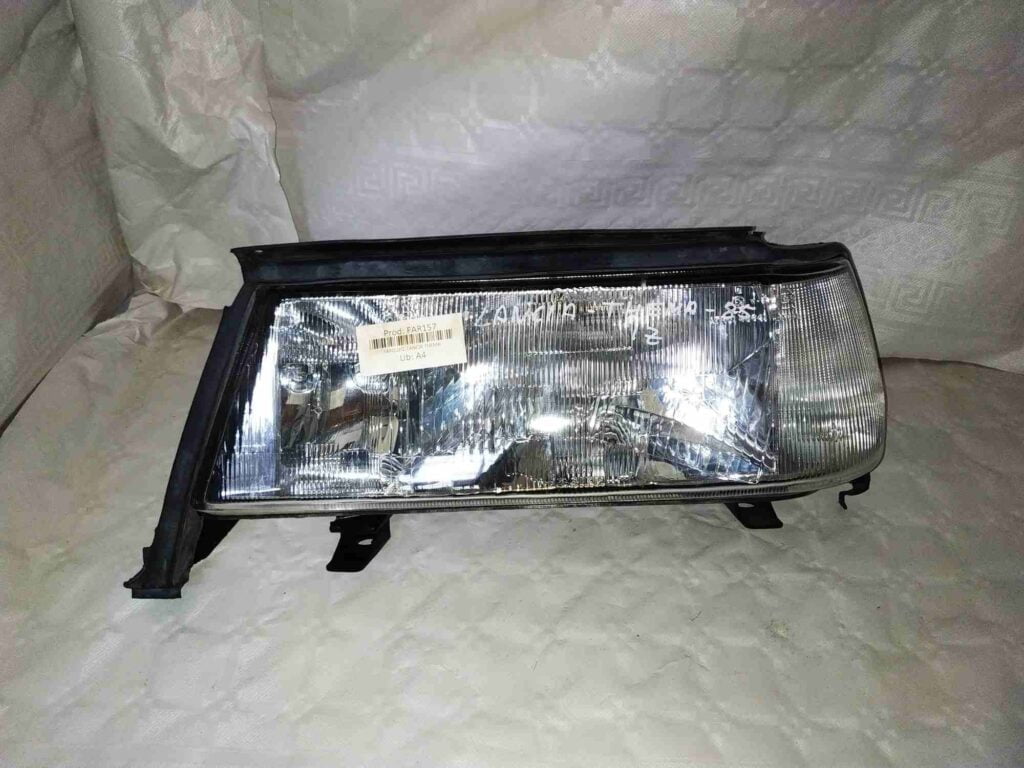 Faro delantero izquierdo nuevo original Lancia Thema 1985